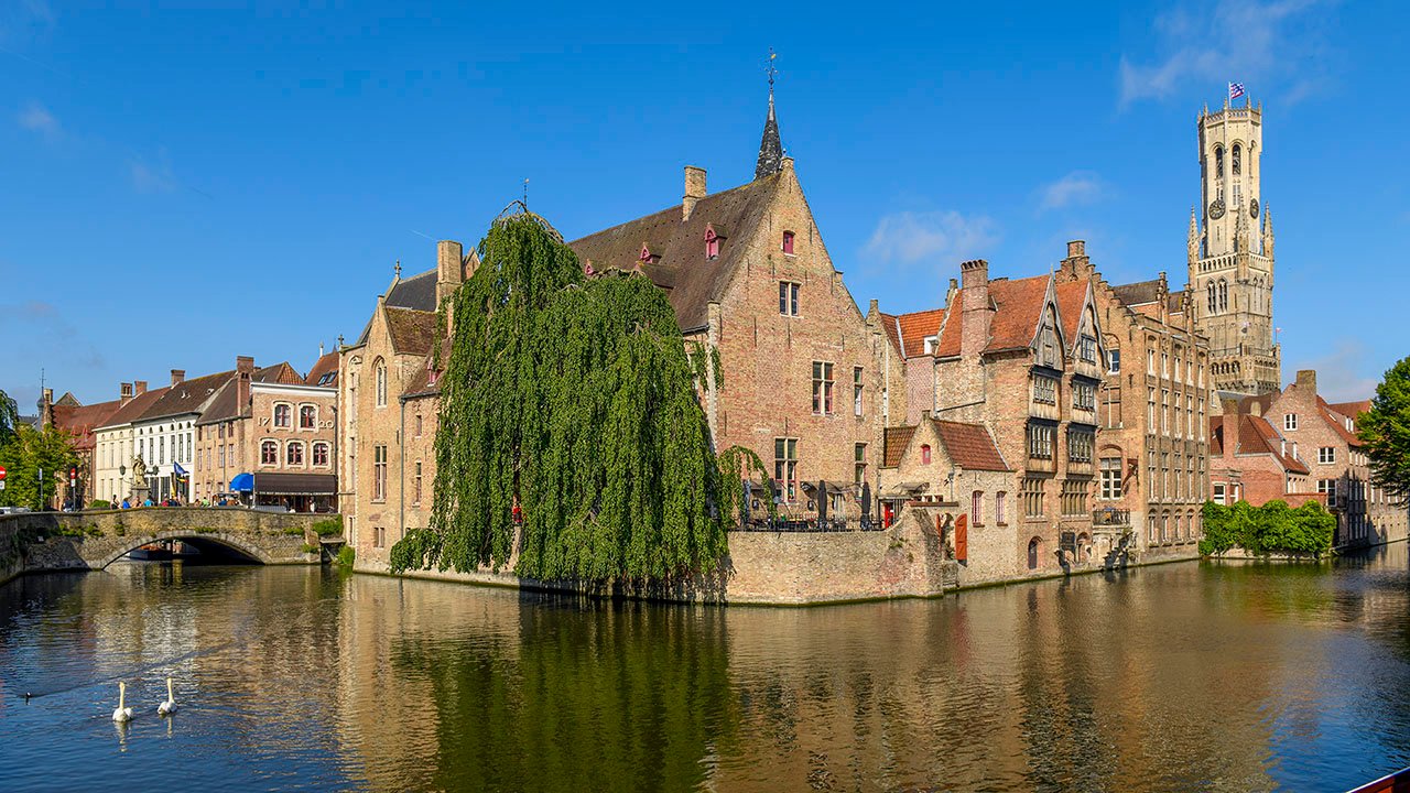Bruges Corner Canal Rozenhoedkaai, the most picturesque spot on the canals of Bruges where the Groenerei and Dijver canals meet.