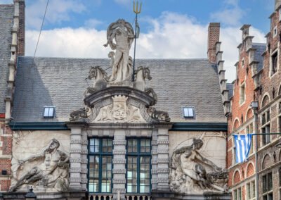 Beautiful Neptune Marble statue in the facade of the old fish market in Ghent